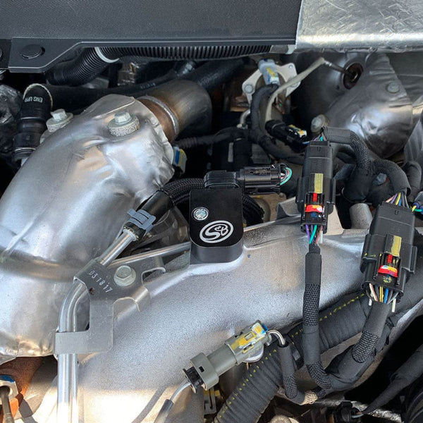 Open car hood revealing an SB Upper MAP Sensor Spacer Kit for 2017-2025 Duramax L5P - S&B
