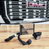 SB Map sensor spacer and its packaging in front of a GMC vehicle grille.
